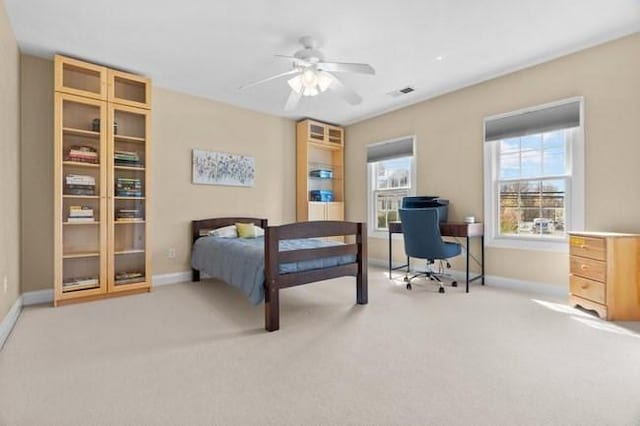 bedroom with baseboards, carpet flooring, and visible vents