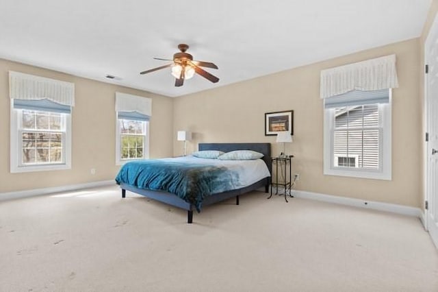bedroom with carpet floors, a ceiling fan, and baseboards