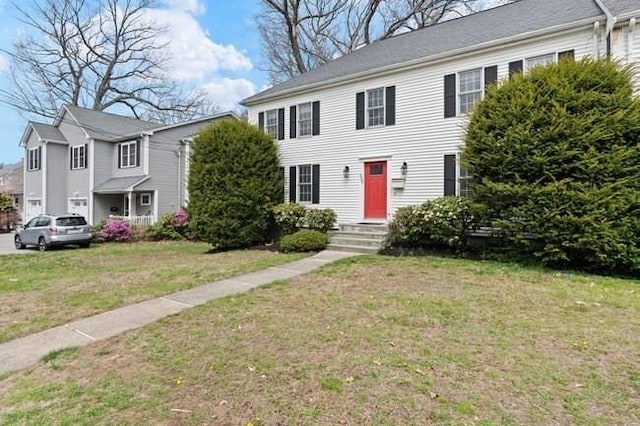 colonial home with a front yard