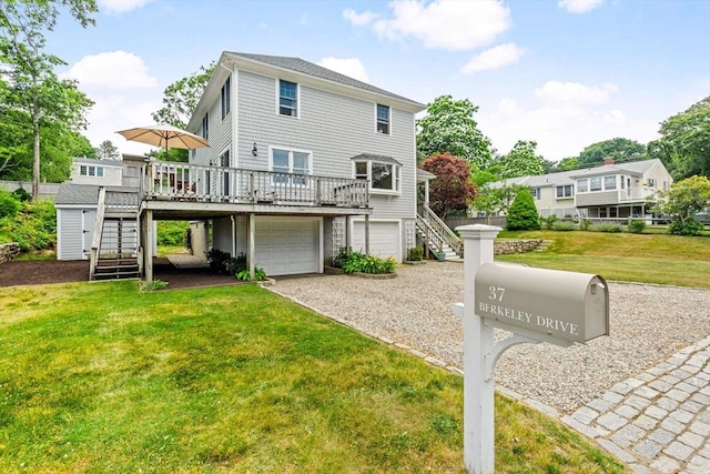 37 Berkeley Dr, Falmouth, MA 02536 - back of house with stairs, a deck, a lawn, and an attached garage