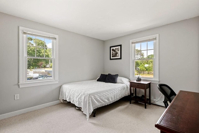 37 Berkeley Dr, Falmouth, MA 02536 - bedroom with multiple windows, light colored carpet, and an office area