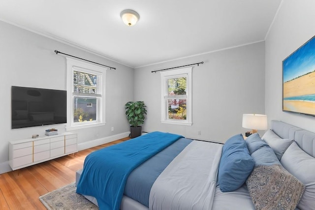 708 Belmont St Unit 708, Watertown, MA 02472 - bedroom with crown molding, baseboards, and wood finished floors