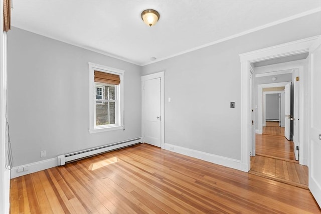 708 Belmont St Unit 708, Watertown, MA 02472 - unfurnished room featuring light wood-style floors, baseboards, and a baseboard radiator