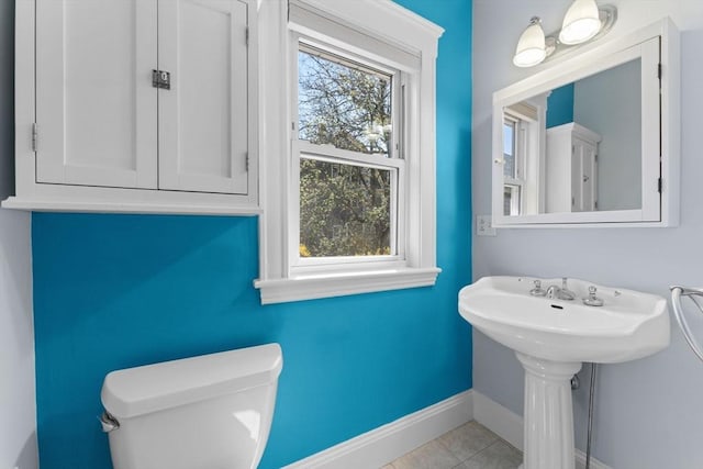 708 Belmont St Unit 708, Watertown, MA 02472 - half bath with baseboards, tile patterned floors, and toilet
