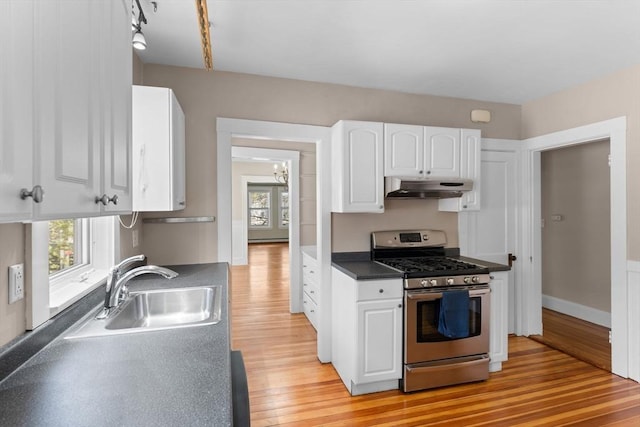 708 Belmont St Unit 708, Watertown, MA 02472 - kitchen with white cabinets, a sink, light wood-style floors, stainless steel range with gas stovetop, and under cabinet range hood
