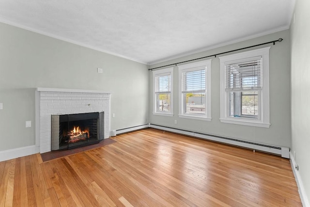 708 Belmont St Unit 708, Watertown, MA 02472 - unfurnished living room featuring a brick fireplace, crown molding, a baseboard heating unit, and light wood finished floors