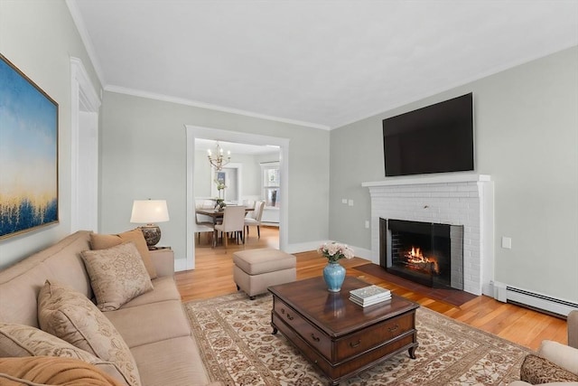 708 Belmont St Unit 708, Watertown, MA 02472 - living room featuring crown molding, baseboard heating, wood finished floors, and a chandelier