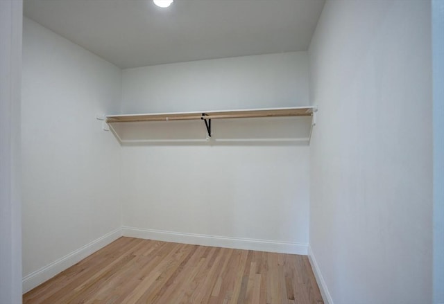 spacious closet with wood finished floors