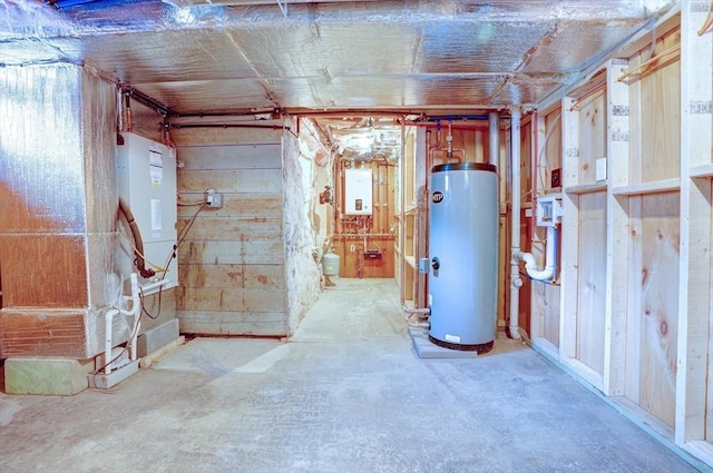 unfinished basement with water heater and tankless water heater