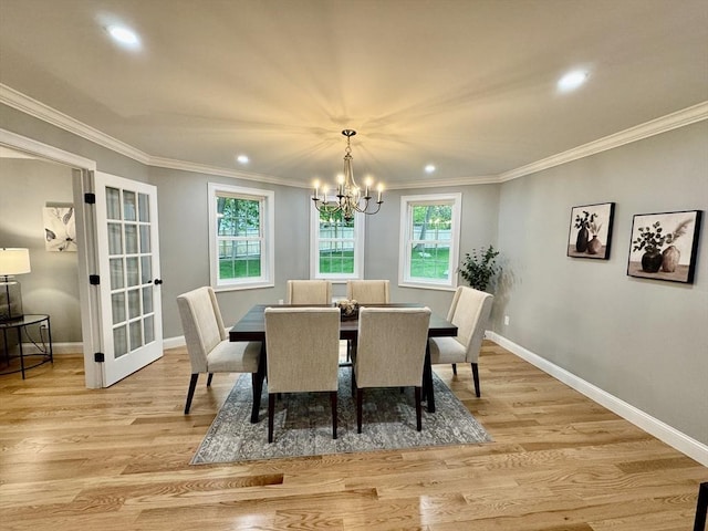 dining area featuring crown molding, recessed lighting, a chandelier, baseboards, and light wood-type flooring