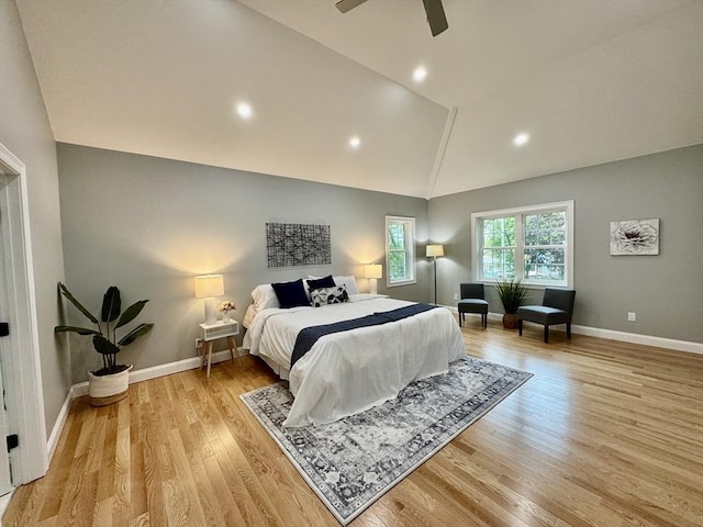 bedroom featuring lofted ceiling, light wood finished floors, baseboards, a ceiling fan, and recessed lighting