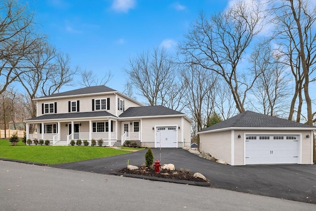view of front of house with a porch and a front lawn