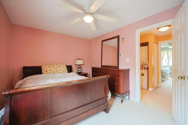 6 Janet Rd Unit 10, Easton, MA 02375 - bedroom with stacked washer / dryer, light carpet, baseboards, and ceiling fan