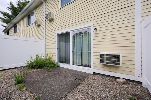 6 Janet Rd Unit 10, Easton, MA 02375 - rear view of house with a patio area and a wall unit AC