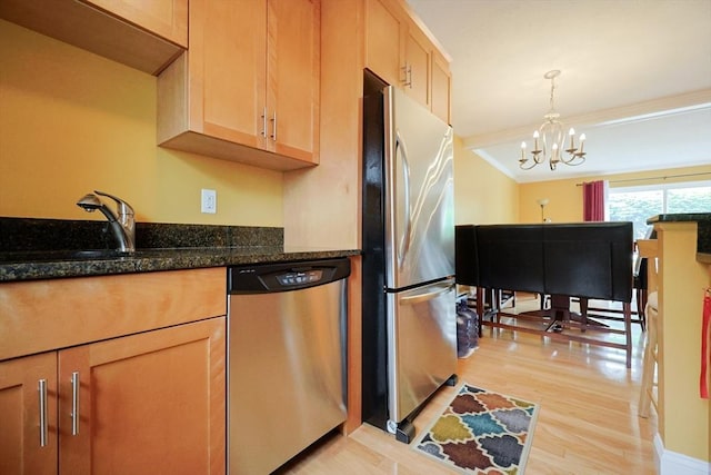 6 Janet Rd Unit 10, Easton, MA 02375 - kitchen with appliances with stainless steel finishes, a sink, a chandelier, light wood finished floors, and decorative light fixtures