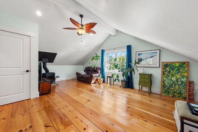 bonus room featuring vaulted ceiling with beams, baseboards, ceiling fan, and hardwood / wood-style flooring