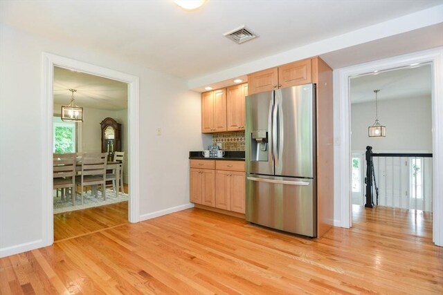 23 Green Lodge St, Canton, MA 02021 - kitchen with stainless steel fridge with ice dispenser, light wood-type flooring, dark countertops, and baseboards
