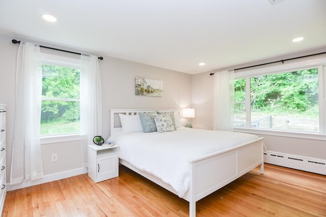 23 Green Lodge St, Canton, MA 02021 - bedroom with light wood-type flooring, a baseboard radiator, baseboards, and recessed lighting