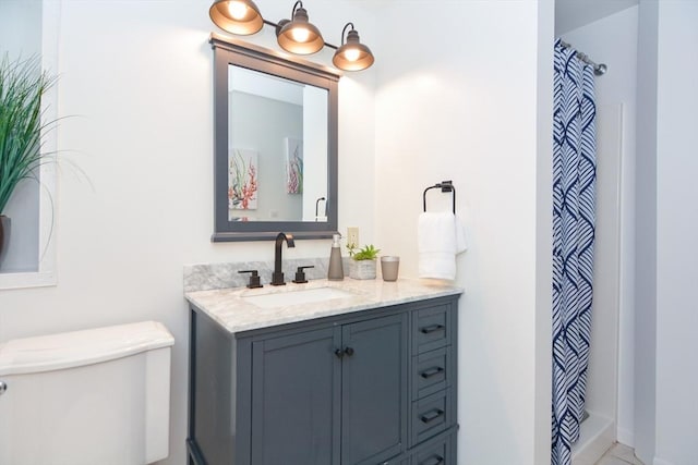 23 Green Lodge St, Canton, MA 02021 - bathroom with toilet, vanity, curtained shower, and baseboards