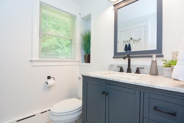 23 Green Lodge St, Canton, MA 02021 - bathroom featuring a baseboard radiator, vanity, and toilet