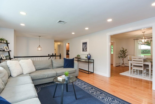 23 Green Lodge St, Canton, MA 02021 - living area featuring light wood finished floors, recessed lighting, a chandelier, and baseboards
