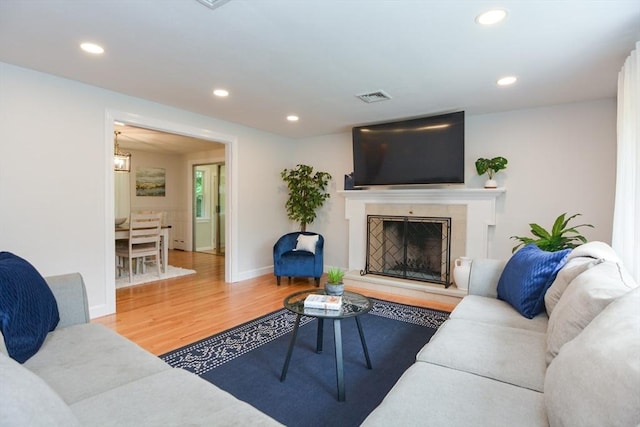 23 Green Lodge St, Canton, MA 02021 - living room featuring wood finished floors, recessed lighting, a fireplace, and baseboards
