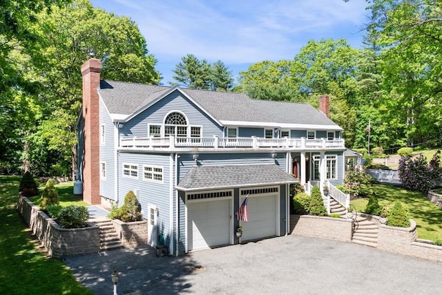 20 Stagecoach Rd, Topsfield, MA 01983 - view of front of house featuring a chimney, a balcony, and roof with shingles