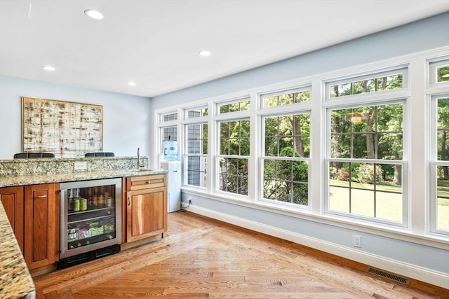 20 Stagecoach Rd, Topsfield, MA 01983 - indoor bar featuring wine cooler, baseboards, light wood-type flooring, and recessed lighting