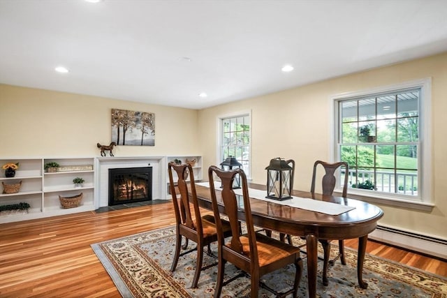 20 Stagecoach Rd, Topsfield, MA 01983 - dining room with wood finished floors, a fireplace with flush hearth, recessed lighting, and baseboard heating