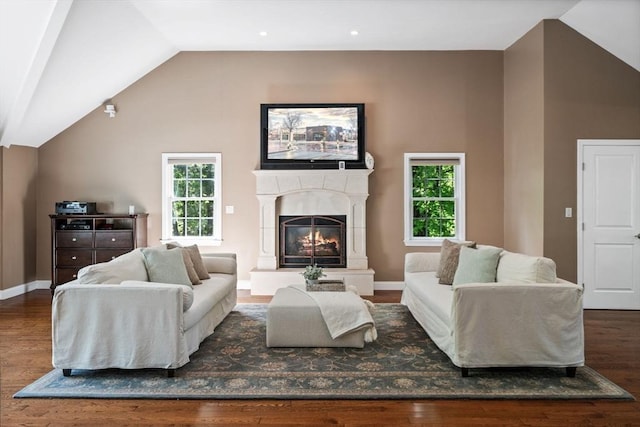 20 Stagecoach Rd, Topsfield, MA 01983 - living area with wood finished floors, plenty of natural light, lofted ceiling, a glass covered fireplace, and baseboards