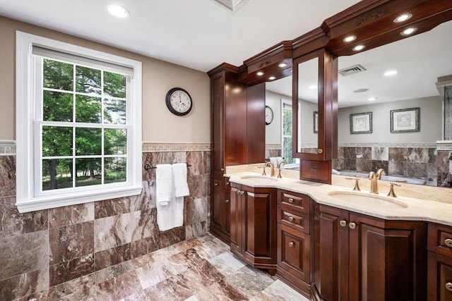 20 Stagecoach Rd, Topsfield, MA 01983 - bathroom featuring tile walls, double vanity, wainscoting, and recessed lighting
