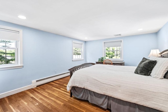 20 Stagecoach Rd, Topsfield, MA 01983 - bedroom featuring a baseboard heating unit, wood finished floors, recessed lighting, and baseboards