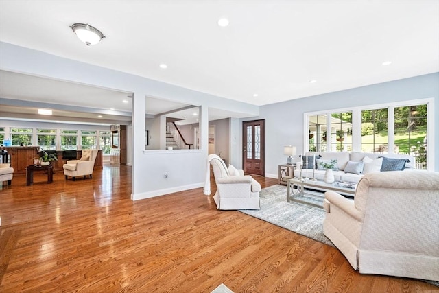 20 Stagecoach Rd, Topsfield, MA 01983 - living room featuring light wood-style flooring, baseboards, stairway, healthy amount of natural light, and recessed lighting
