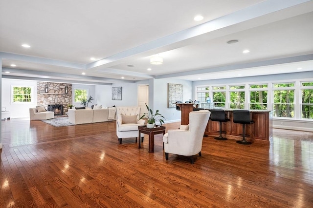 20 Stagecoach Rd, Topsfield, MA 01983 - living room featuring dark wood-type flooring, bar, recessed lighting, a stone fireplace, and baseboards
