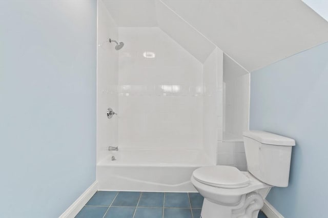 full bathroom with tile patterned flooring, baseboards, toilet, lofted ceiling, and shower / bathtub combination