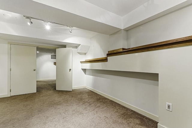 14 Weybridge Ln Unit 14, Hopkinton, MA 01748 - finished below grade area featuring carpet flooring, track lighting, and baseboards