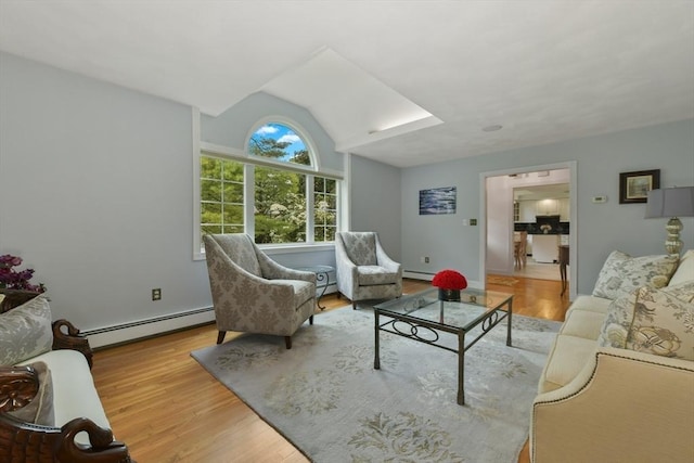 1 Fox Hunt Ln, Winchester, MA 01890 - living room featuring a baseboard heating unit, vaulted ceiling, wood finished floors, and a baseboard radiator
