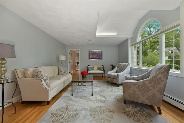 1 Fox Hunt Ln, Winchester, MA 01890 - living area with a baseboard heating unit, wood finished floors, and vaulted ceiling