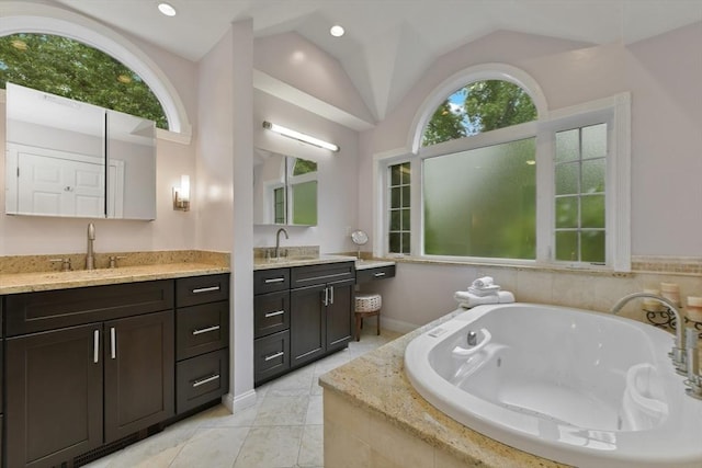 1 Fox Hunt Ln, Winchester, MA 01890 - full bath with two vanities, lofted ceiling, a whirlpool tub, tile patterned flooring, and recessed lighting