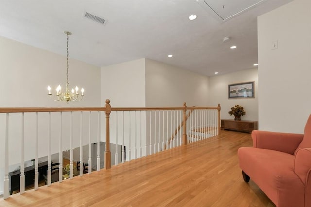 1 Fox Hunt Ln, Winchester, MA 01890 - living area with attic access, wood finished floors, recessed lighting, an upstairs landing, and a chandelier