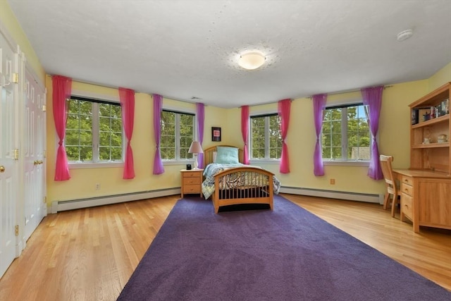 1 Fox Hunt Ln, Winchester, MA 01890 - bedroom with a baseboard radiator and wood finished floors