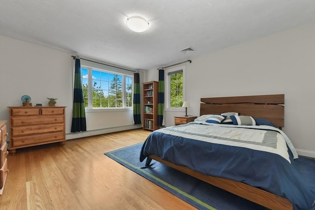 1 Fox Hunt Ln, Winchester, MA 01890 - bedroom with baseboard heating and wood finished floors