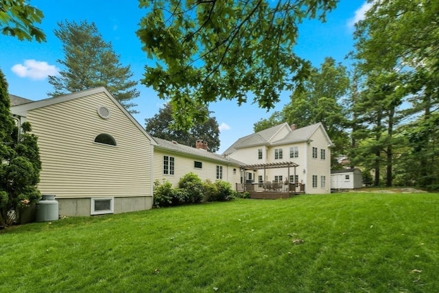 1 Fox Hunt Ln, Winchester, MA 01890 - rear view of property featuring a pergola, a lawn, a deck, and a chimney