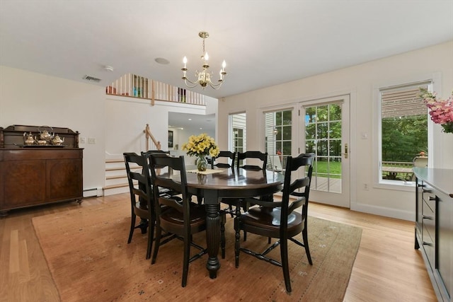 1 Fox Hunt Ln, Winchester, MA 01890 - dining space with a chandelier, light wood-style flooring, and a baseboard heating unit