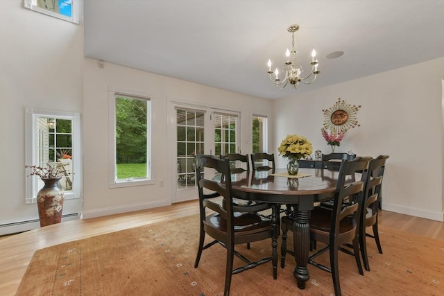1 Fox Hunt Ln, Winchester, MA 01890 - dining room with a chandelier, light wood-style flooring, healthy amount of natural light, and a baseboard radiator