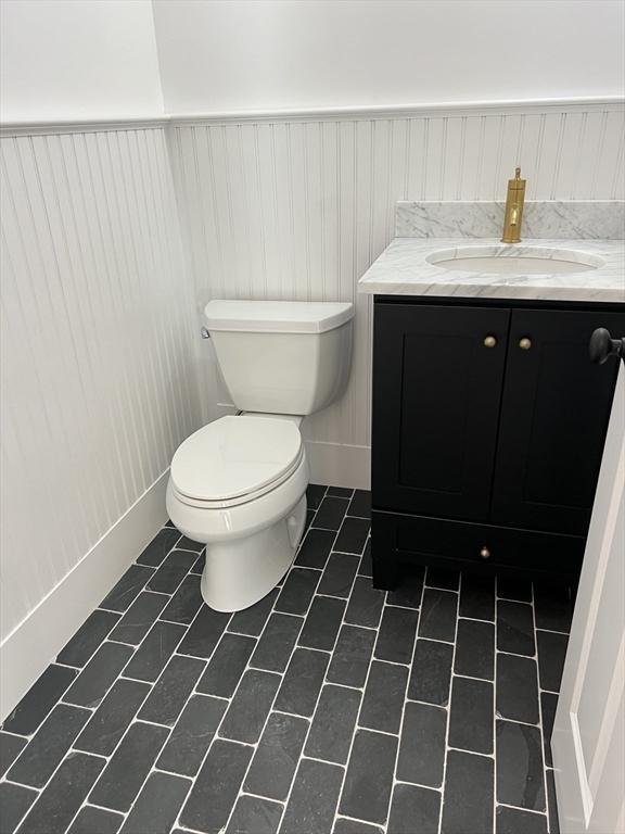 16 Clearview St, Grafton, MA 01536 - half bath with toilet, vanity, and wainscoting