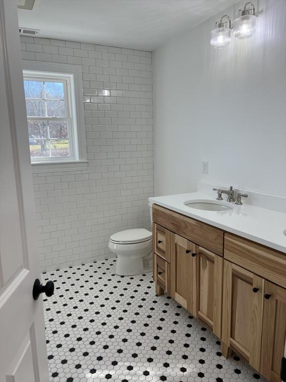 16 Clearview St, Grafton, MA 01536 - bathroom with toilet, vanity, and tile patterned flooring