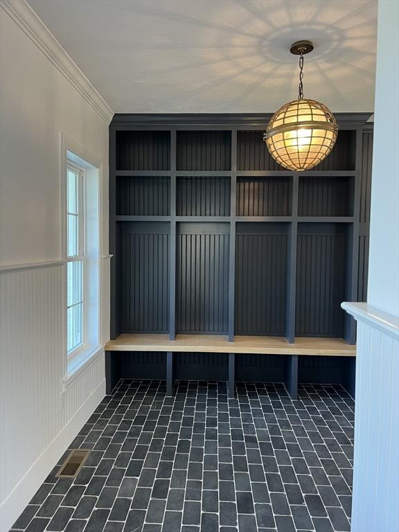 16 Clearview St, Grafton, MA 01536 - mudroom featuring wainscoting, brick patterned flooring, and crown molding