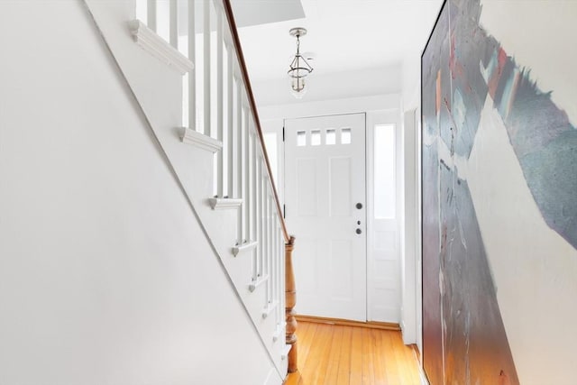 entrance foyer featuring light wood-style flooring and stairway