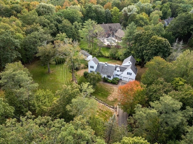 drone / aerial view featuring a forest view